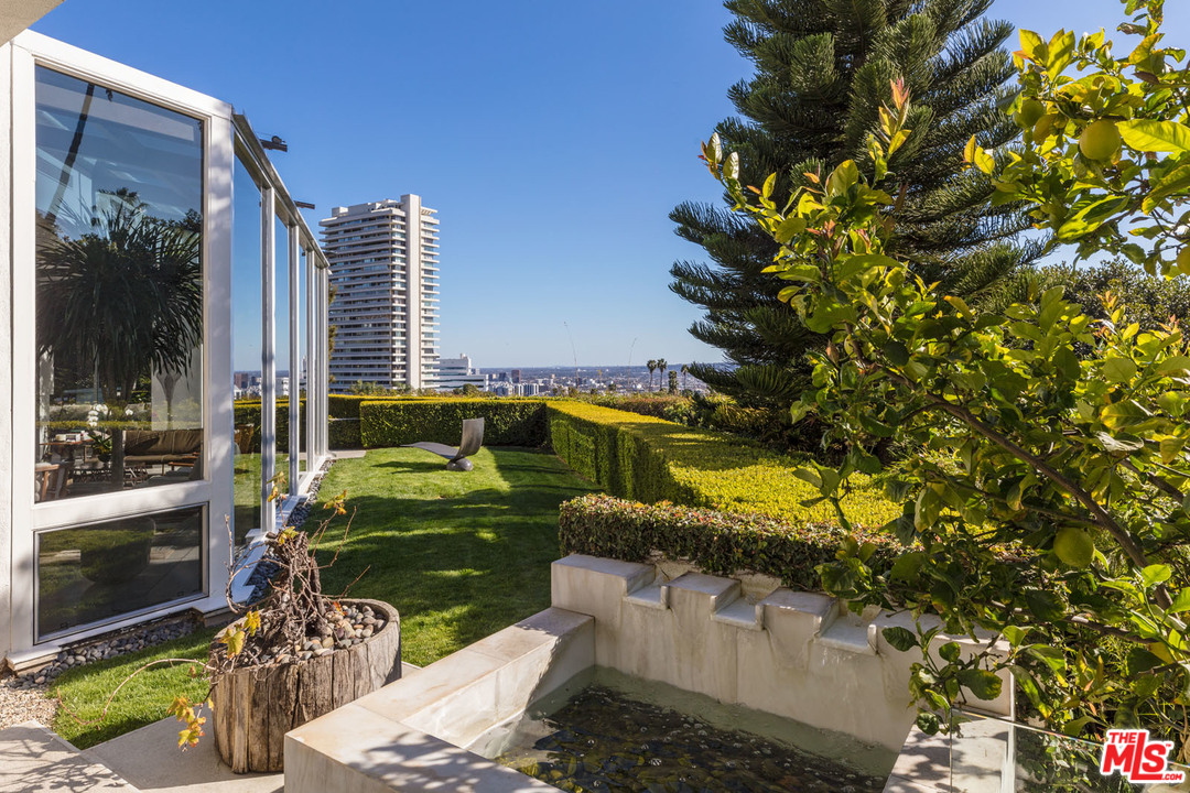 North Hillcrest Road Beverly Hills, CA 90210 - Photo 25 of 34 a view of a balcony with chairs