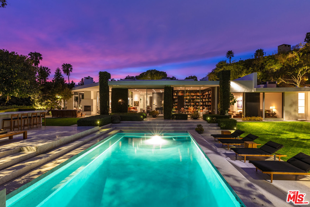 North Hillcrest Road Beverly Hills, CA 90210 - Photo 29 of 34 a view of a house with swimming pool and a yard