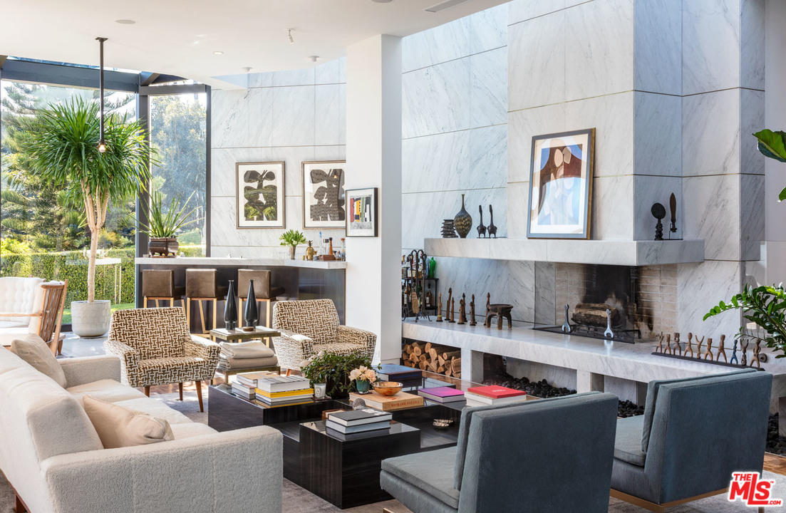 North Hillcrest Road Beverly Hills, CA 90210 - Photo 7 of 34 a work place with furniture and a potted plant