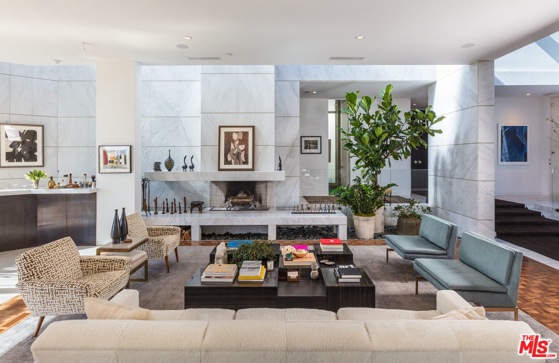 North Hillcrest Road Beverly Hills, CA 90210 - Photo 8 of 34 a living room with furniture and a potted plant