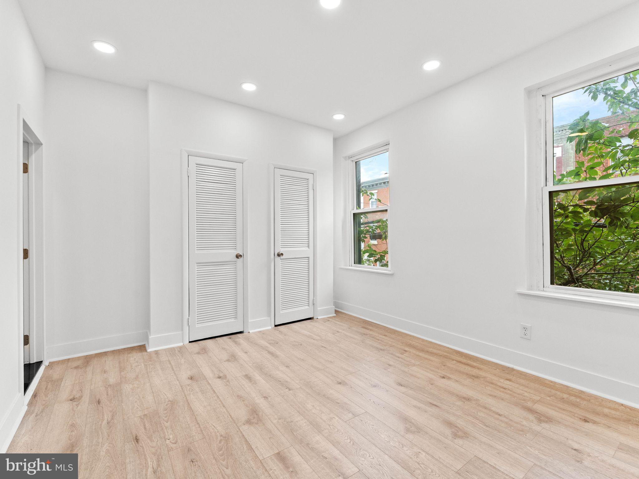 1606 Wharton Street Philadelphia, PA 19146 - Photo 15 of 31 an empty room with wooden floor and windows