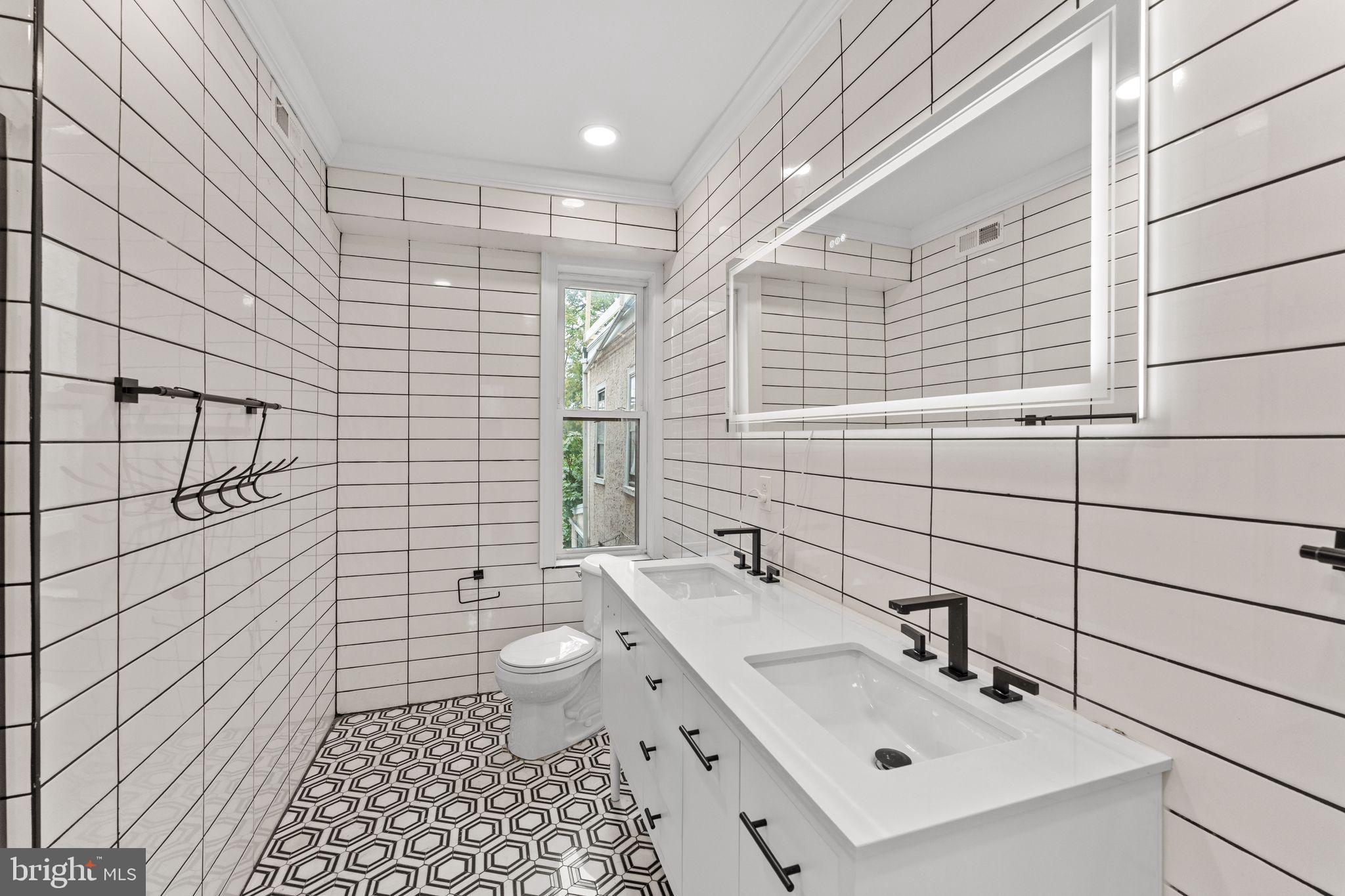 1606 Wharton Street Philadelphia, PA 19146 - Photo 17 of 31 a bathroom with a sink toilet and shower