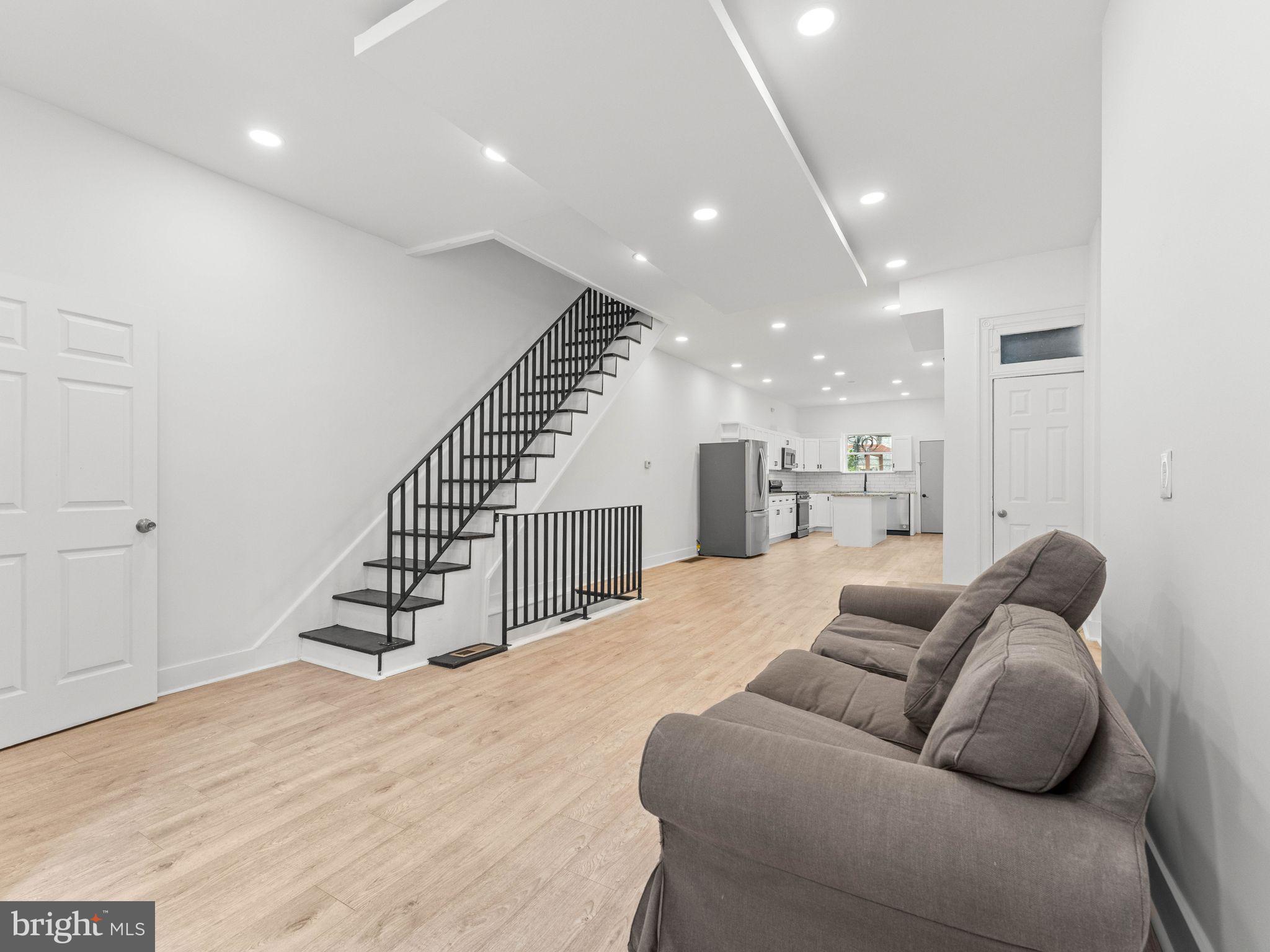 1606 Wharton Street Philadelphia, PA 19146 - Photo 2 of 31 a living room with furniture or wooden floor and a ceiling fan