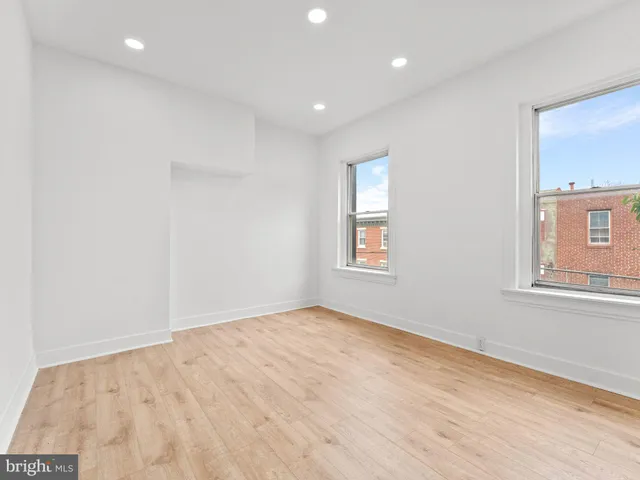 a view of empty room with windows