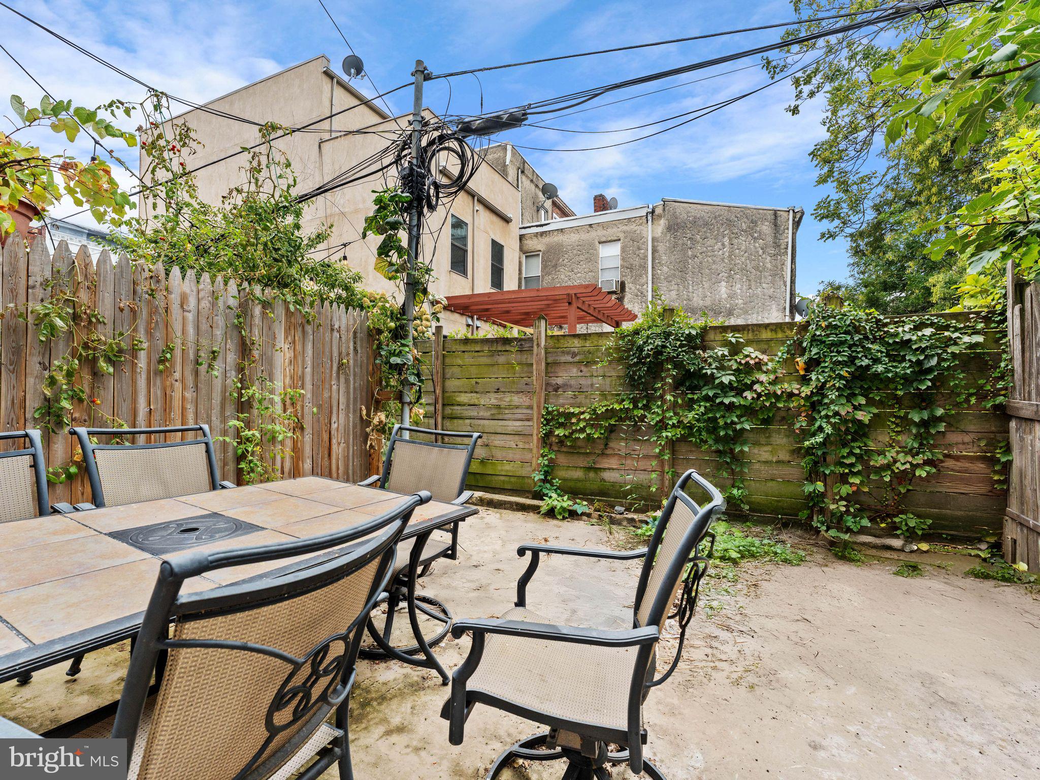 1606 Wharton Street Philadelphia, PA 19146 - Photo 29 of 31 a view of a patio with table and chairs and potted plants