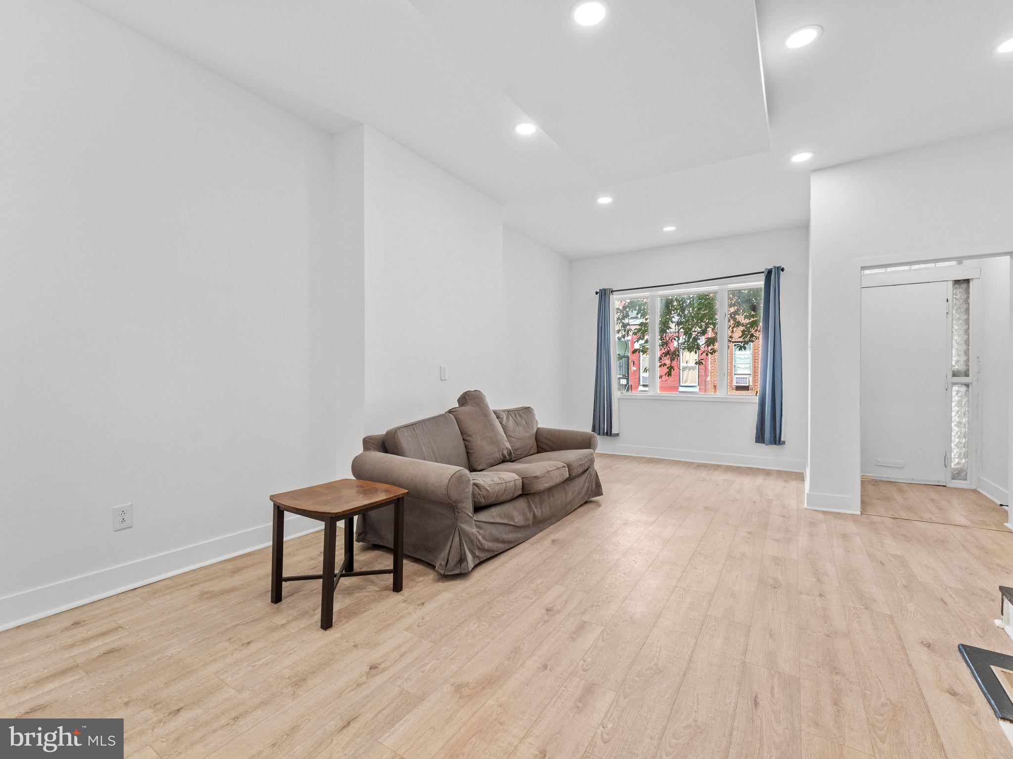 1606 Wharton Street Philadelphia, PA 19146 - Photo 6 of 31 a living room with furniture and a wooden floor