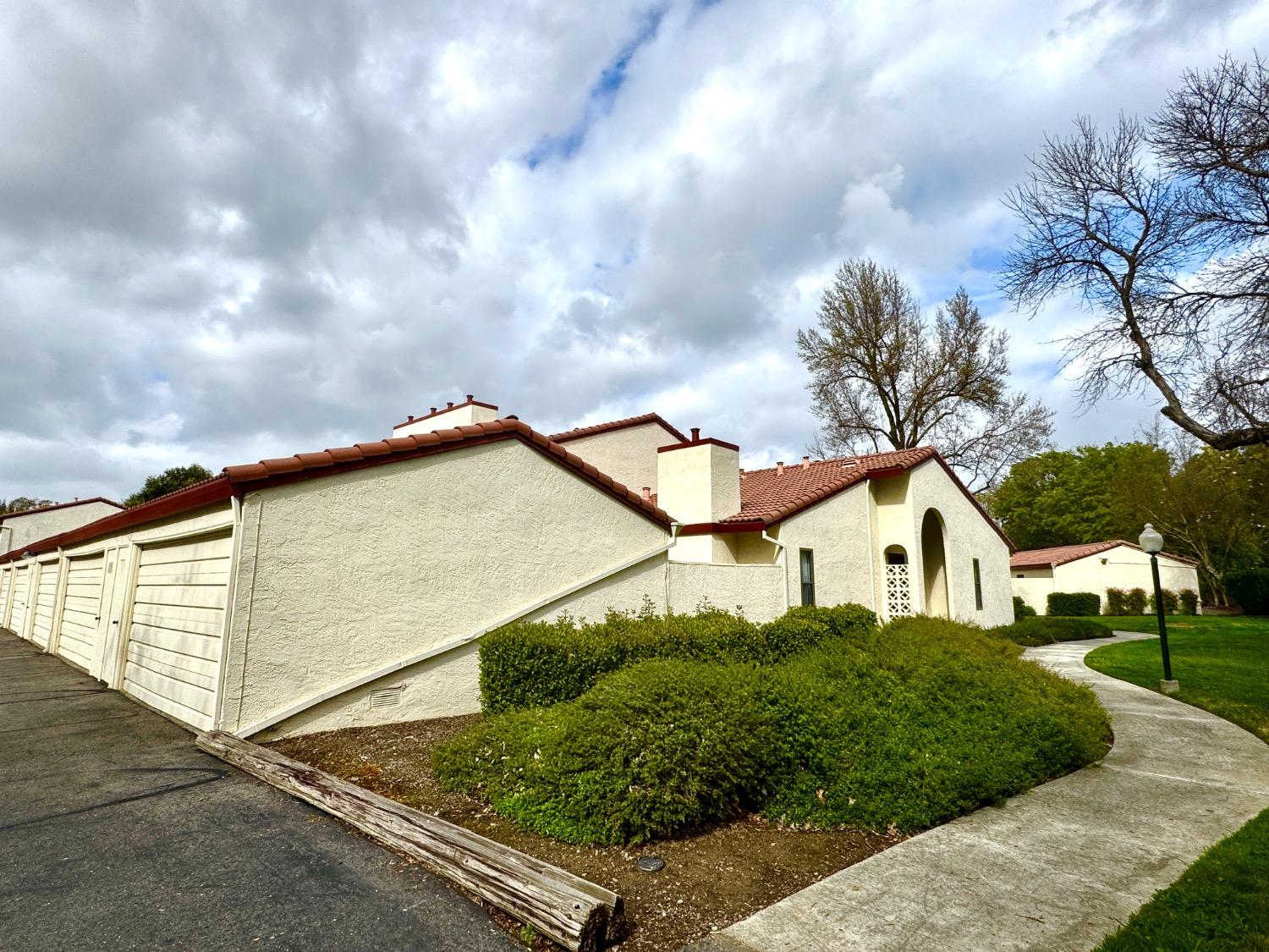 4848 El Cemonte Avenue, Unit 1 Davis, CA 95618 - Photo 1 of 1 a house with trees in the background