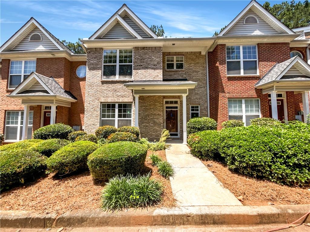 2031 Austin Park Circle Decatur, GA 30032 - Photo 1 of 1 a front view of a house with a yard and potted plants
