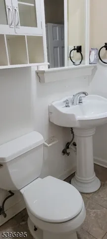 a bathroom with a toilet and a sink