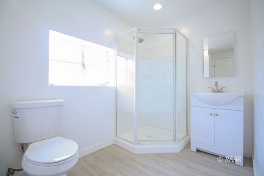 801 South Allen Street Ridgecrest, CA 93555 - Photo 14 of 17 a bathroom with a toilet a sink and shower