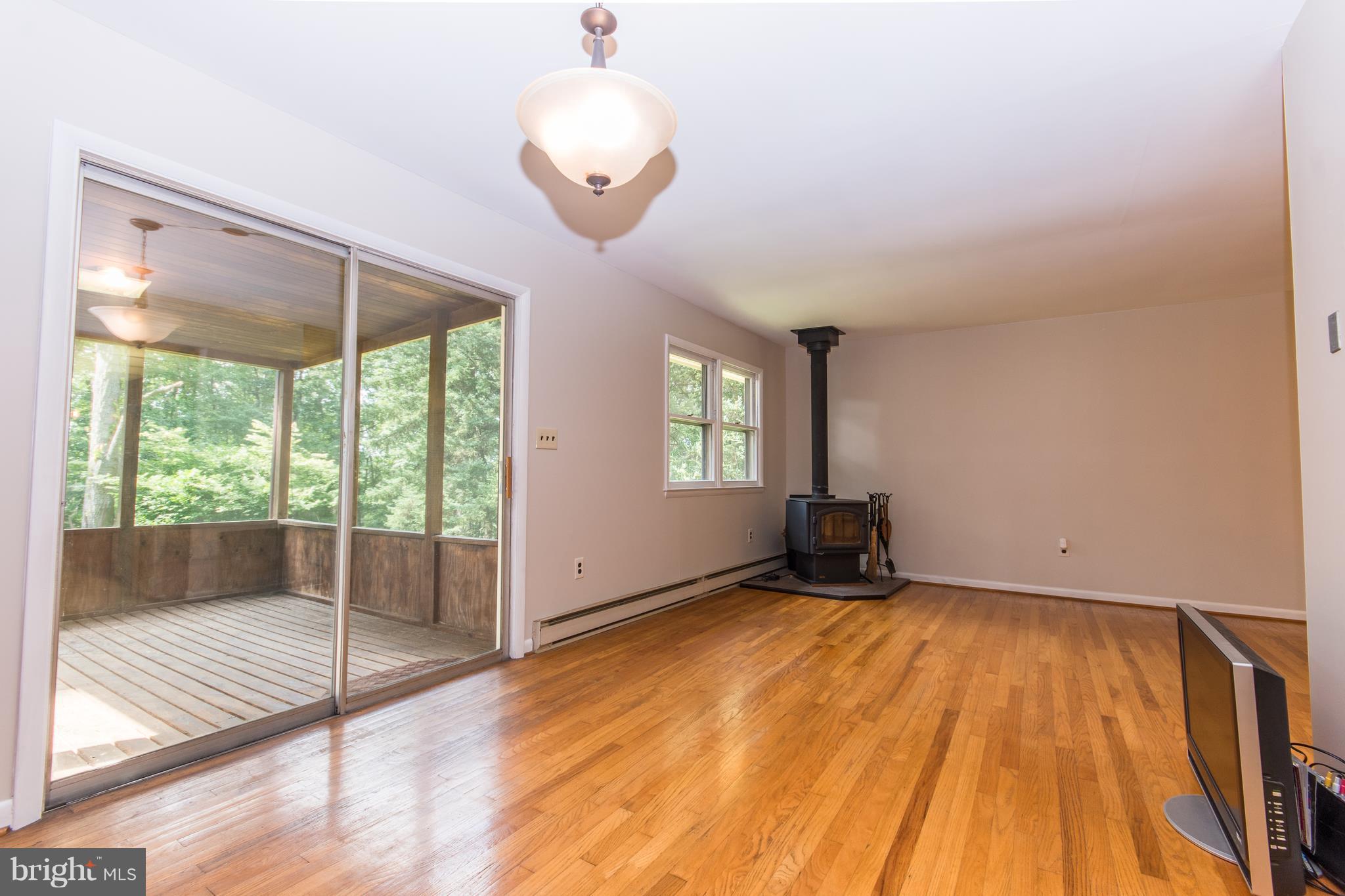 711 Cherrytown Road Westminster, MD 21158 - Photo 11 of 30 Living Room w/ Wood Stove