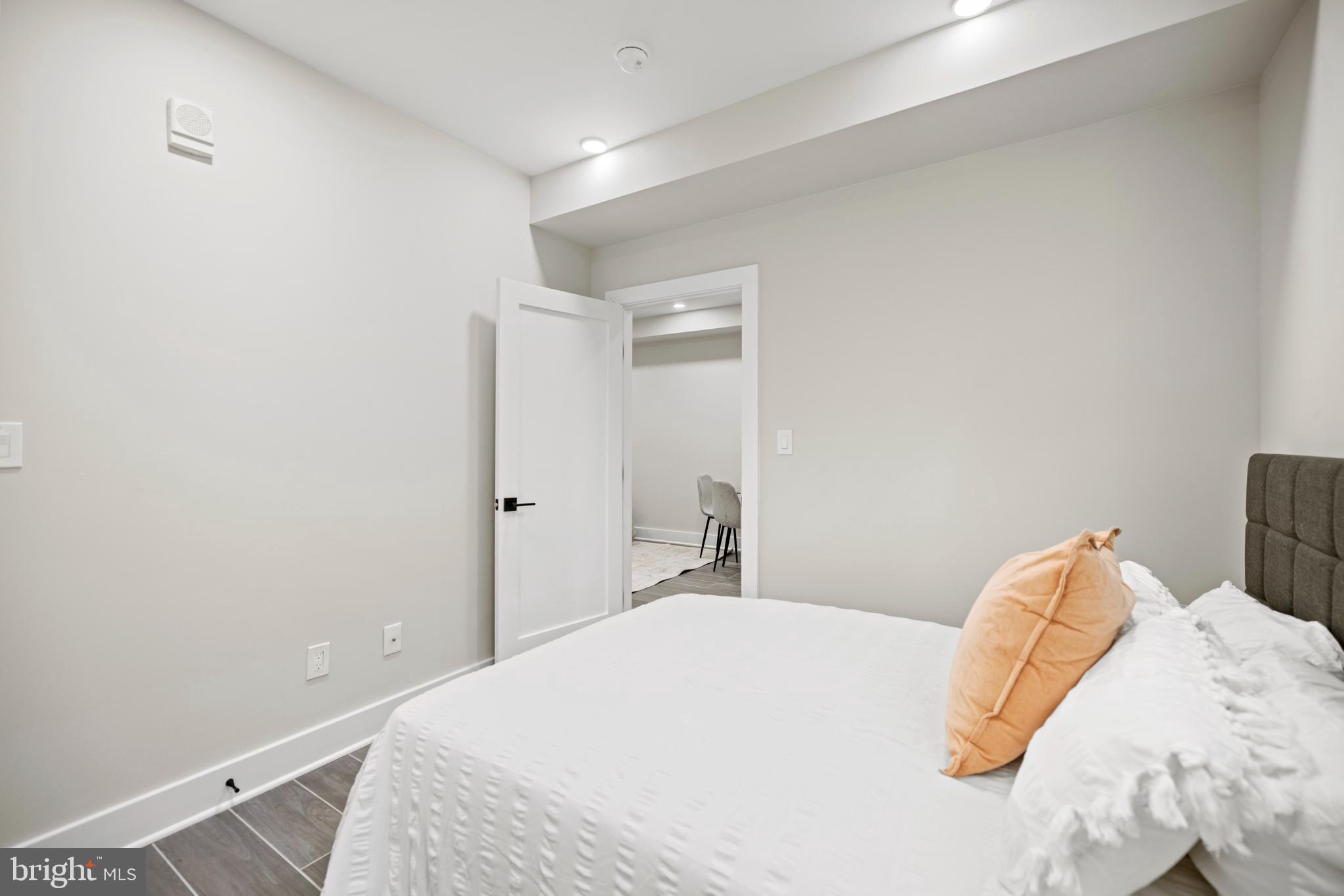 824 18th Street Northeast, Unit 3 Washington, DC 20002 - Photo 15 of 19 a bedroom with a bed and a window