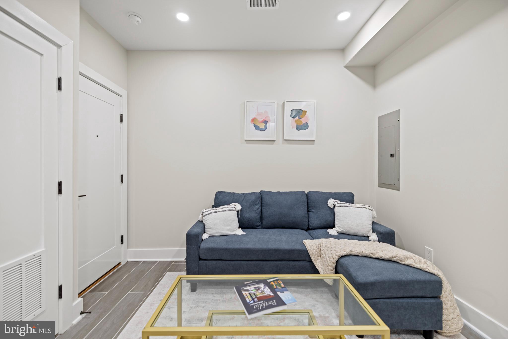 824 18th Street Northeast, Unit 3 Washington, DC 20002 - Photo 7 of 19 a living room with furniture and a rug