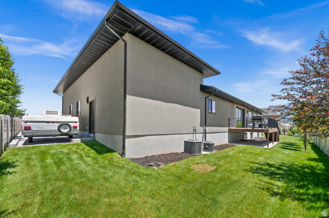 507 West Windmill Gate Cove Draper, UT 84020 - Photo 46 of 46 View of side of home featuring stucco siding and a deck
