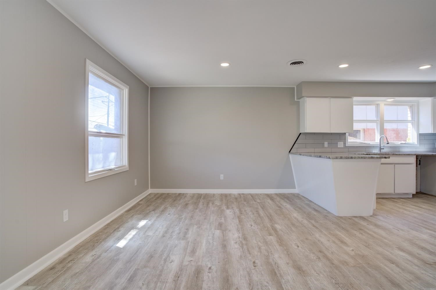 2113 66th Street Lubbock, TX 79412 - Photo 11 of 44 a view of kitchen with wooden floor and electronic appliances