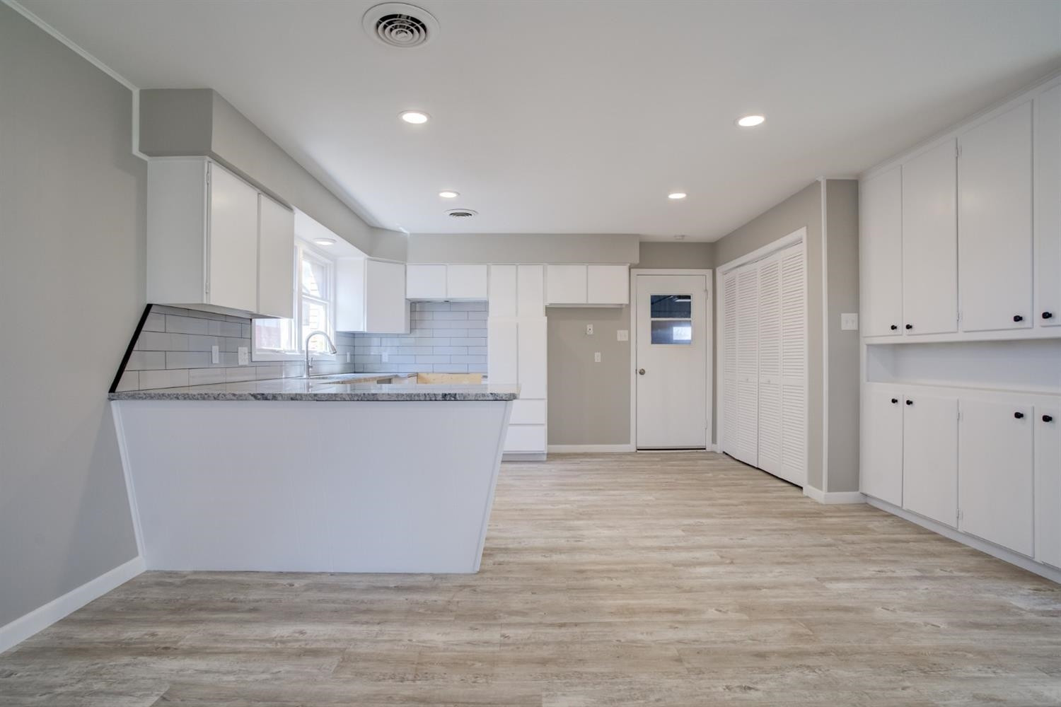 2113 66th Street Lubbock, TX 79412 - Photo 13 of 44 a view of kitchen and kitchen with granite countertop space