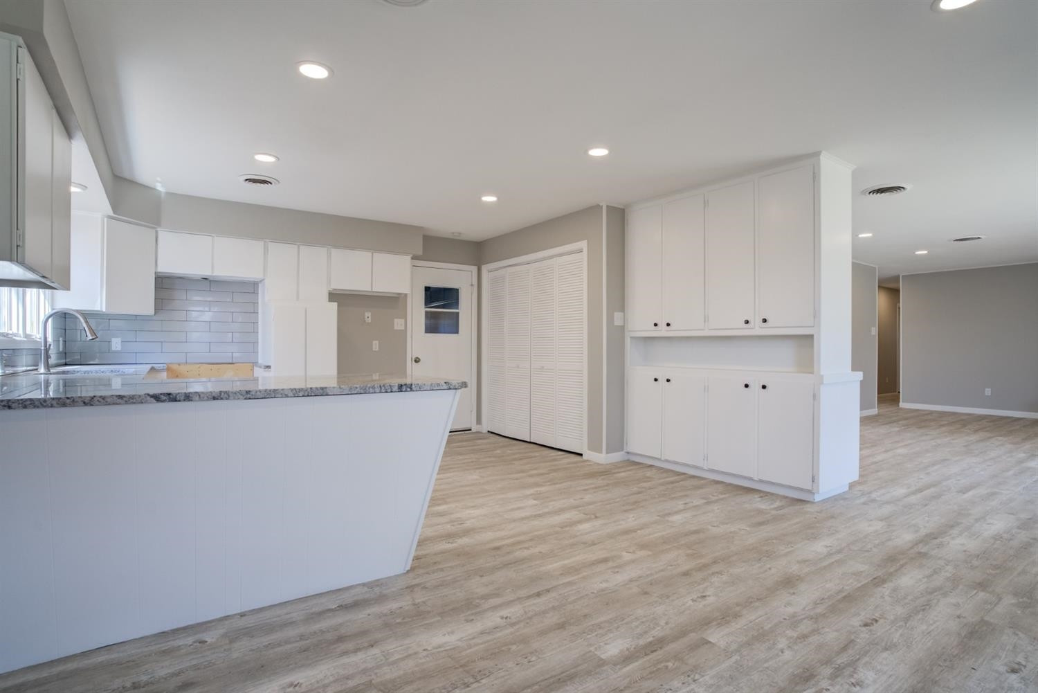 2113 66th Street Lubbock, TX 79412 - Photo 14 of 44 a view of kitchen with wooden floor