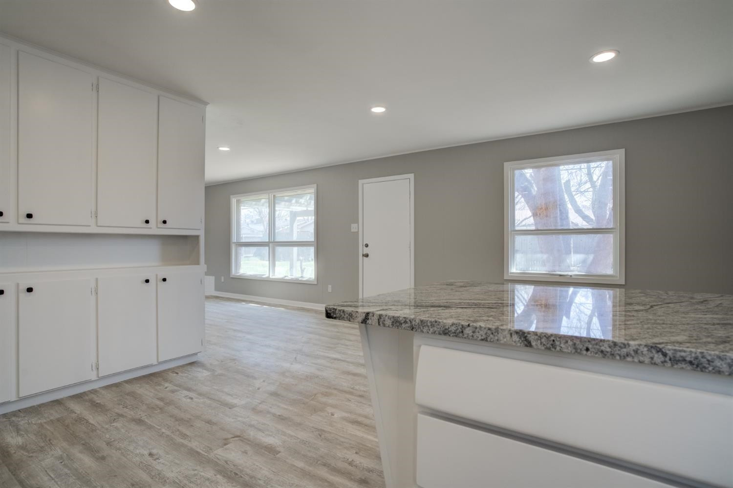 2113 66th Street Lubbock, TX 79412 - Photo 20 of 44 a view of a kitchen with granite countertop white cabinets and a sink