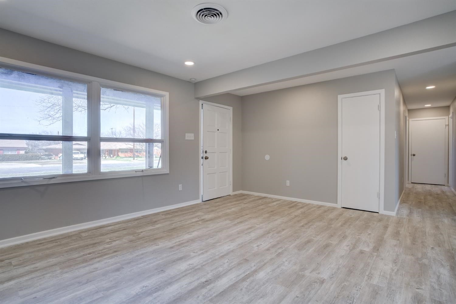 2113 66th Street Lubbock, TX 79412 - Photo 24 of 44 wooden floor in an empty room with a window