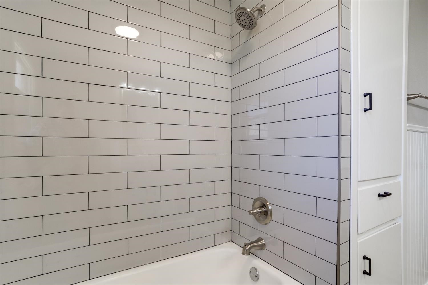 2113 66th Street Lubbock, TX 79412 - Photo 30 of 44 a bathroom with a shower