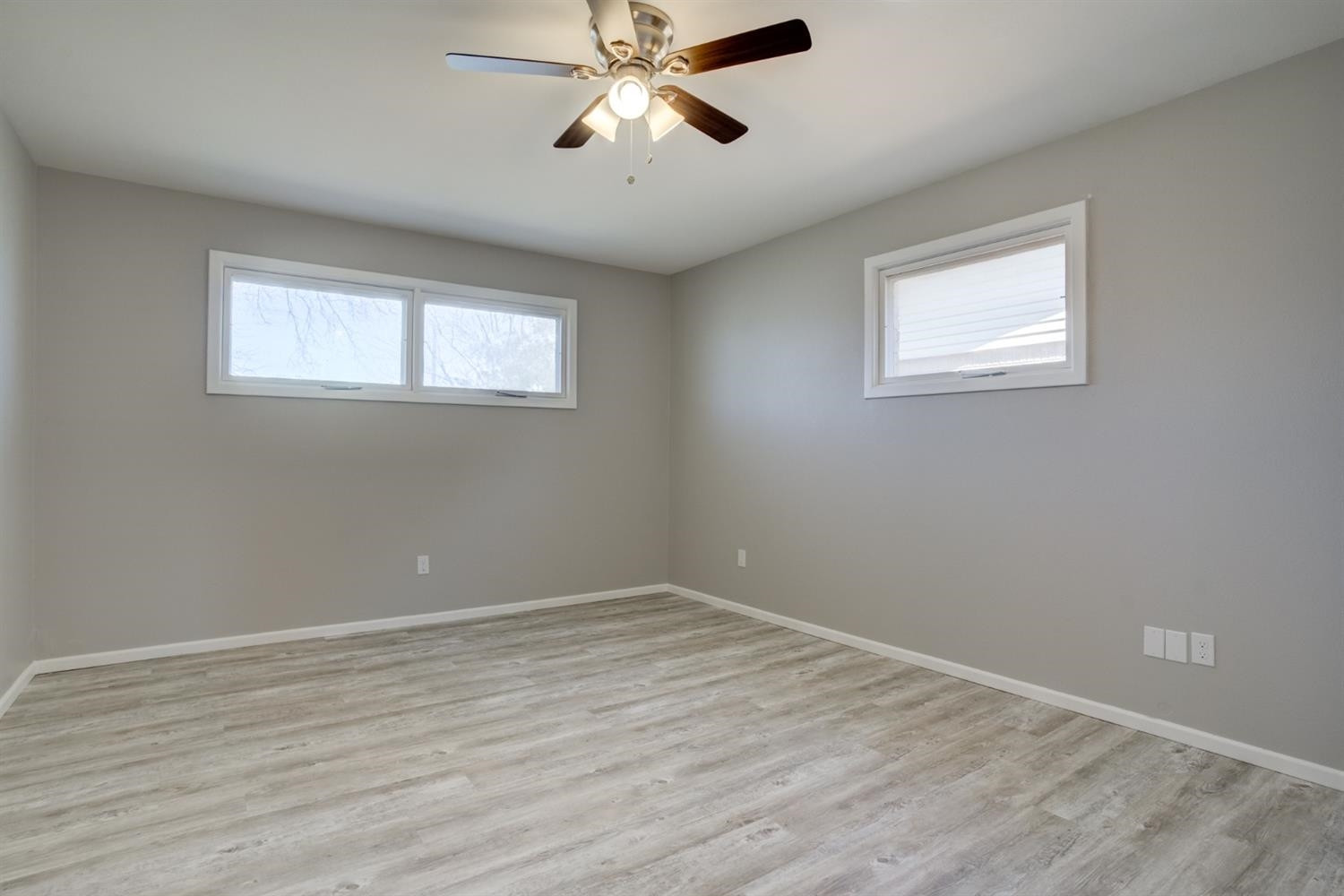 2113 66th Street Lubbock, TX 79412 - Photo 33 of 44 a view of a big room with wooden floor and windows