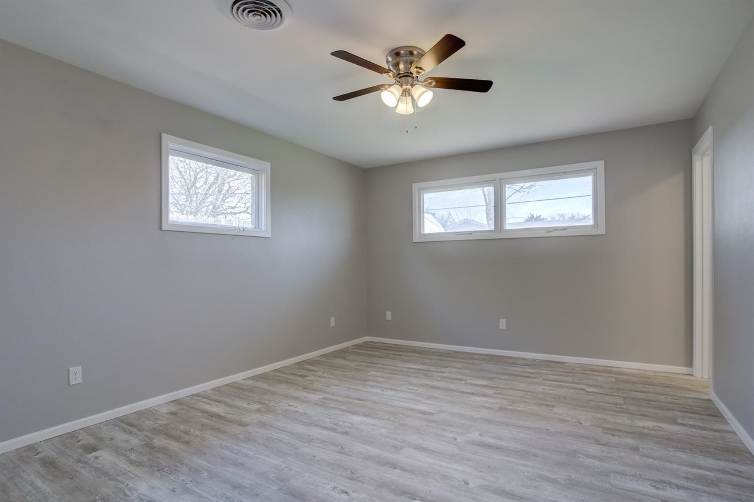 2113 66th Street Lubbock, TX 79412 - Photo 35 of 44 wooden floor in an empty room with a window