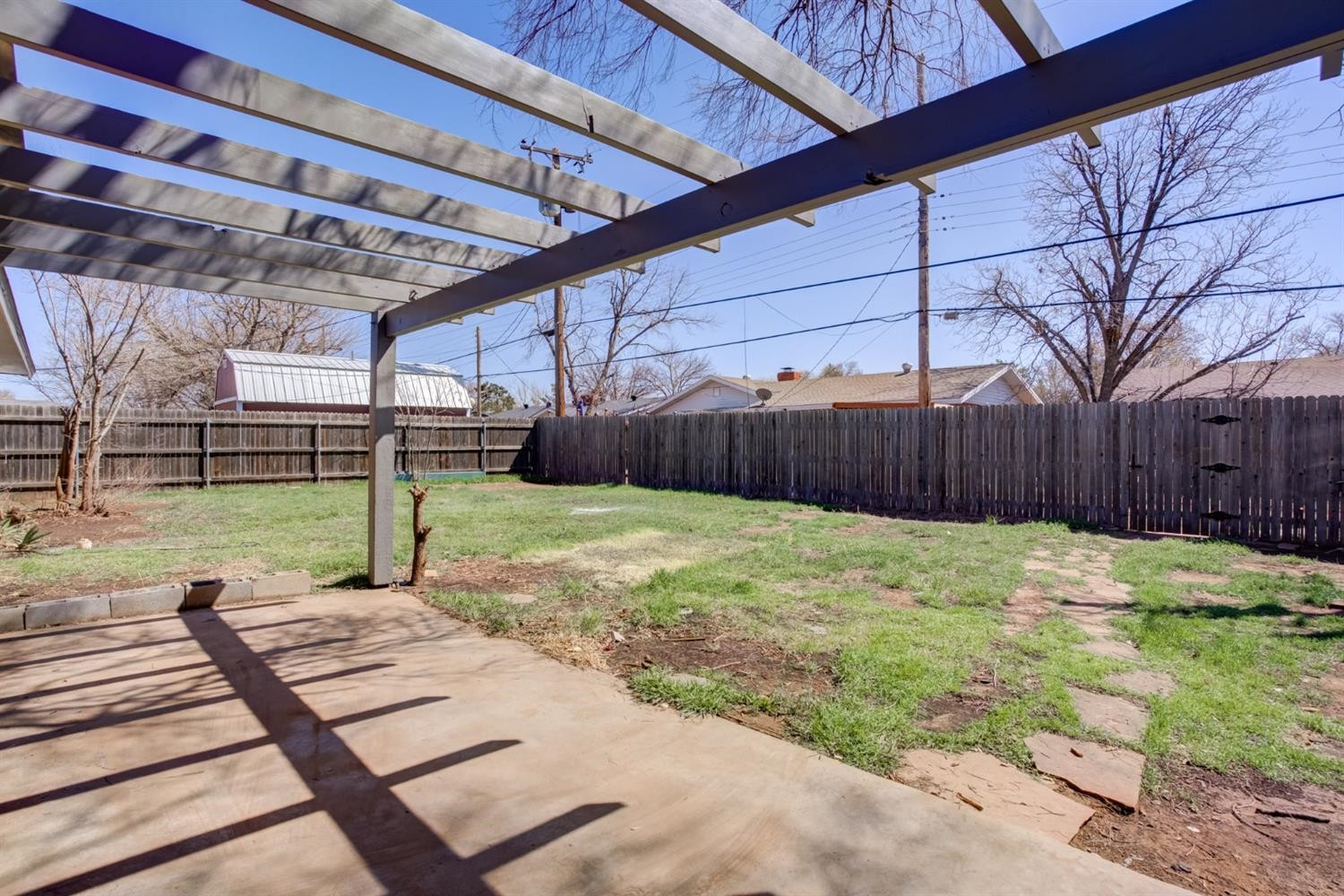 2113 66th Street Lubbock, TX 79412 - Photo 41 of 44 a view of a backyard with wooden fence