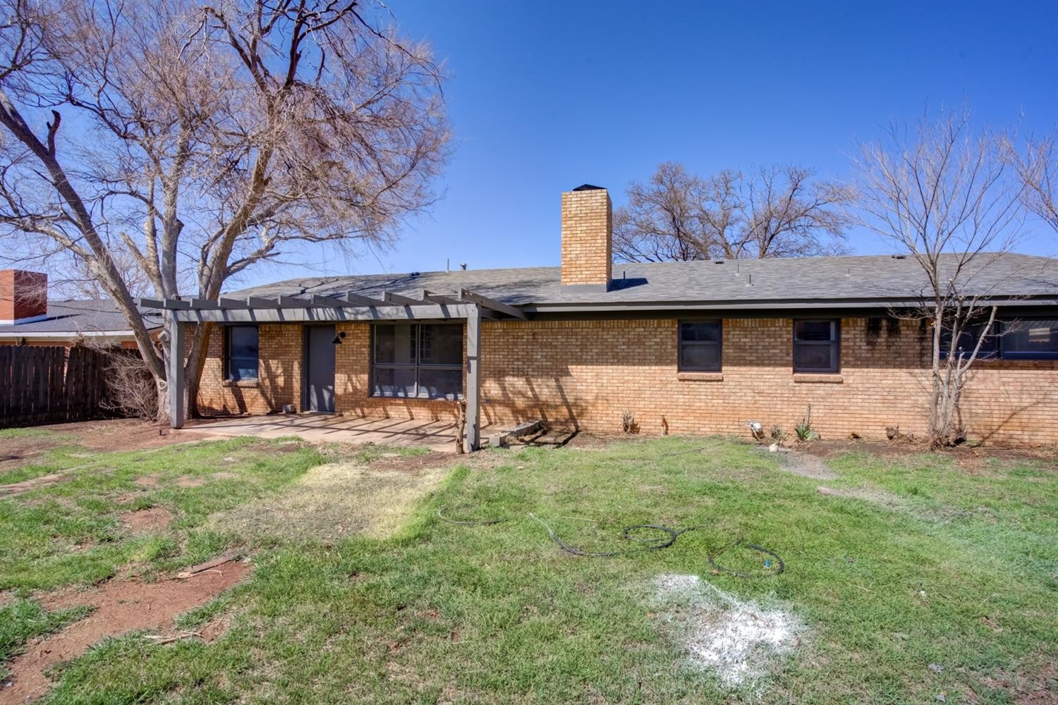 2113 66th Street Lubbock, TX 79412 - Photo 43 of 44 a front view of a house with a garden
