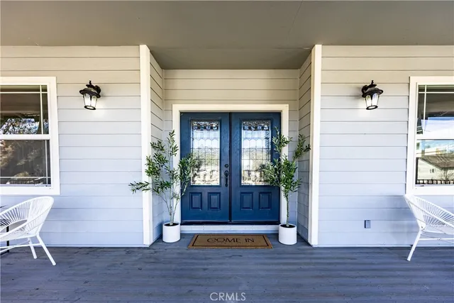a view of front door and wooden floor