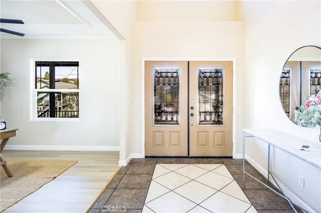 a spacious bathroom with a tub shower and mirror