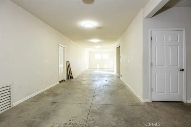 a view of a hallway with closet area