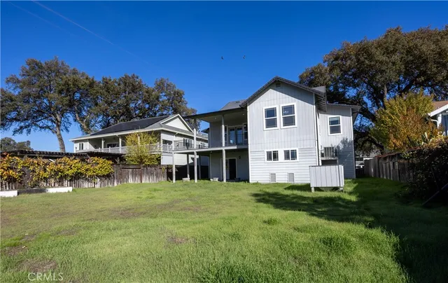 a view of a hallway with wooden floor and closet
