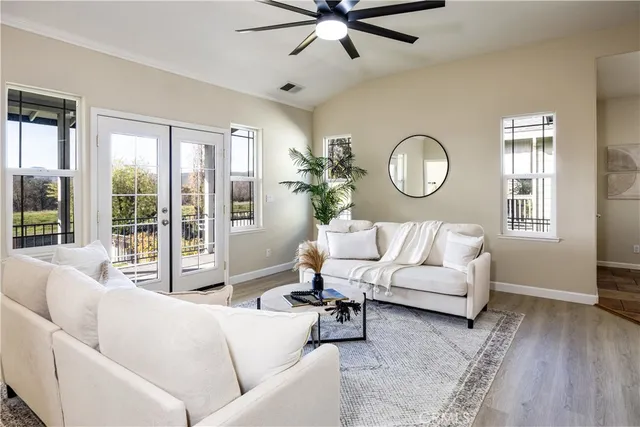 a living room with furniture and a large window