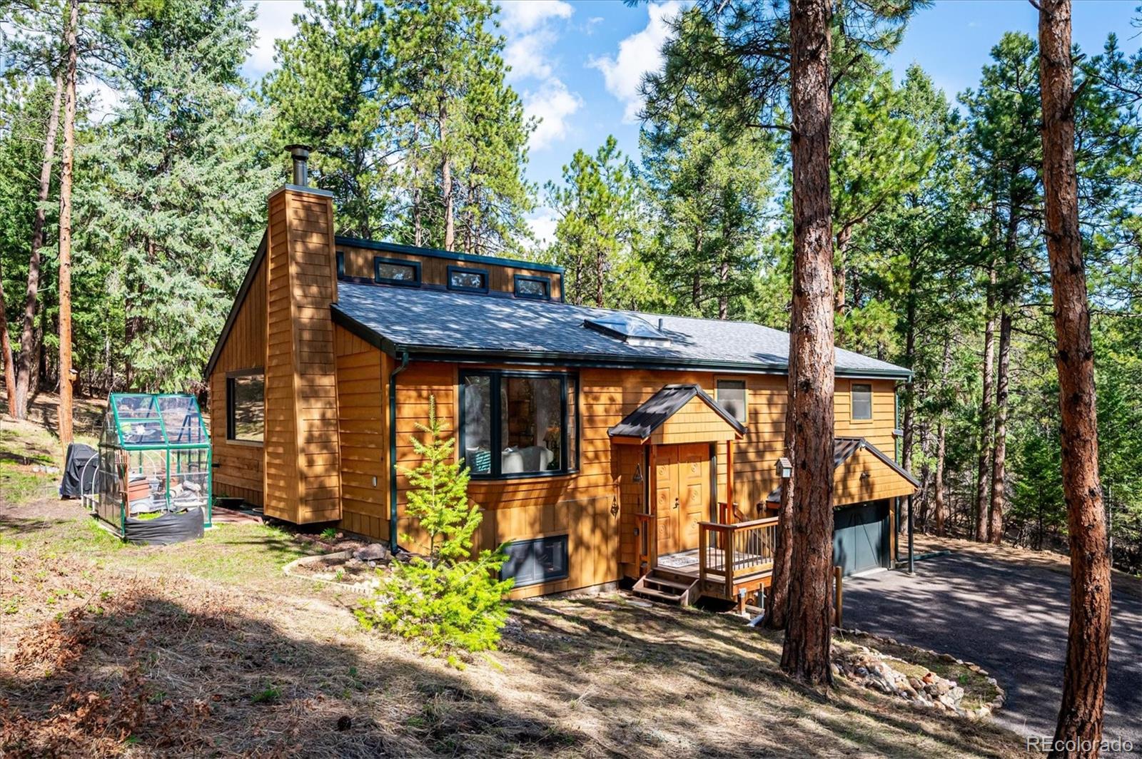 20025 Flint Lane Morrison, CO 80465 - Photo 25 of 35 a view of a house with a yard and wooden fence