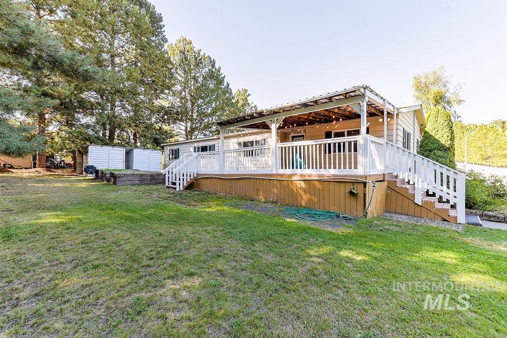 609 North Almon Street, Unit 2011 Moscow, ID 83843 - Photo 43 of 45 Back of house with a lawn and a wooden deck