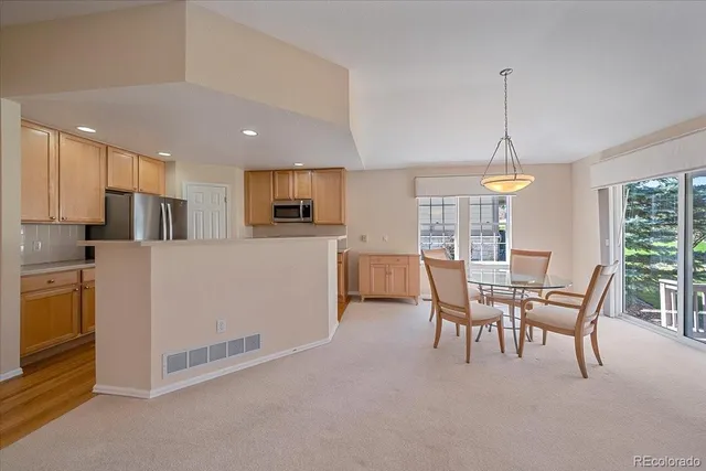 a view of a dining room with furniture window and outside view