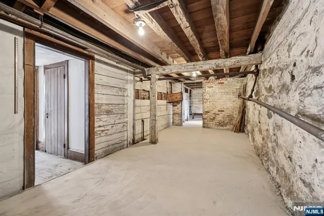 a view of staircase with wooden floor and chair