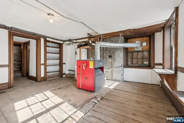 a view of a room with wooden walls