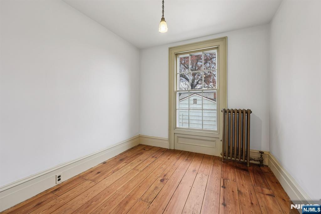 142 Island Road Mahwah, NJ 07430 - Photo 2 of 21 wooden floor in an empty room with a window