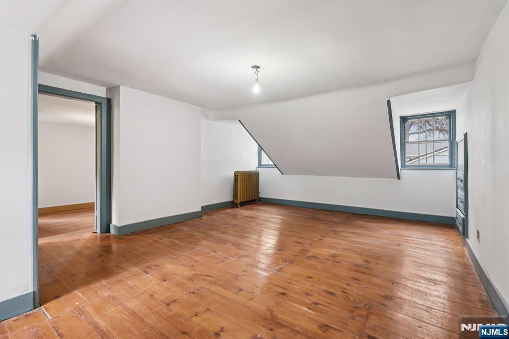 142 Island Road Mahwah, NJ 07430 - Photo 6 of 21 a view of empty room with wooden floor