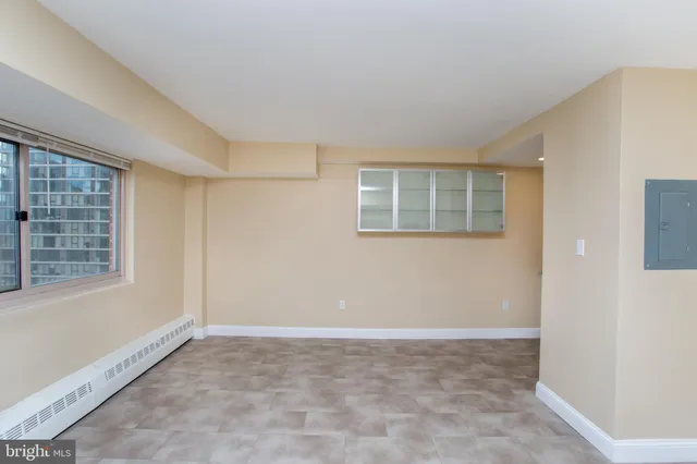 a view of an empty room with a window