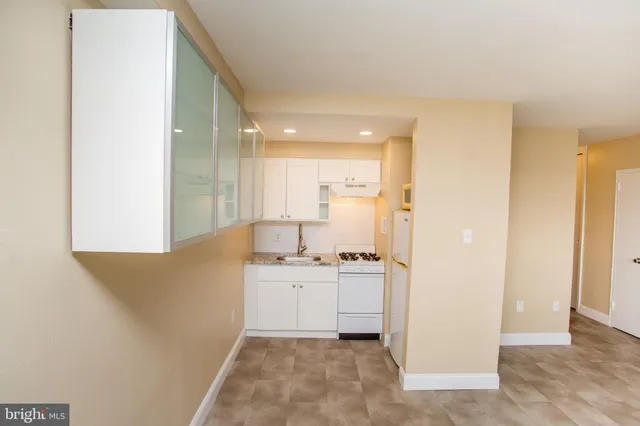a view of a kitchen with electric appliances