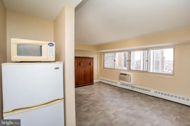 a view of an empty room with a window