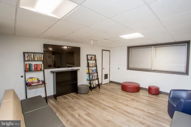 a view of kitchen with refrigerator and chair