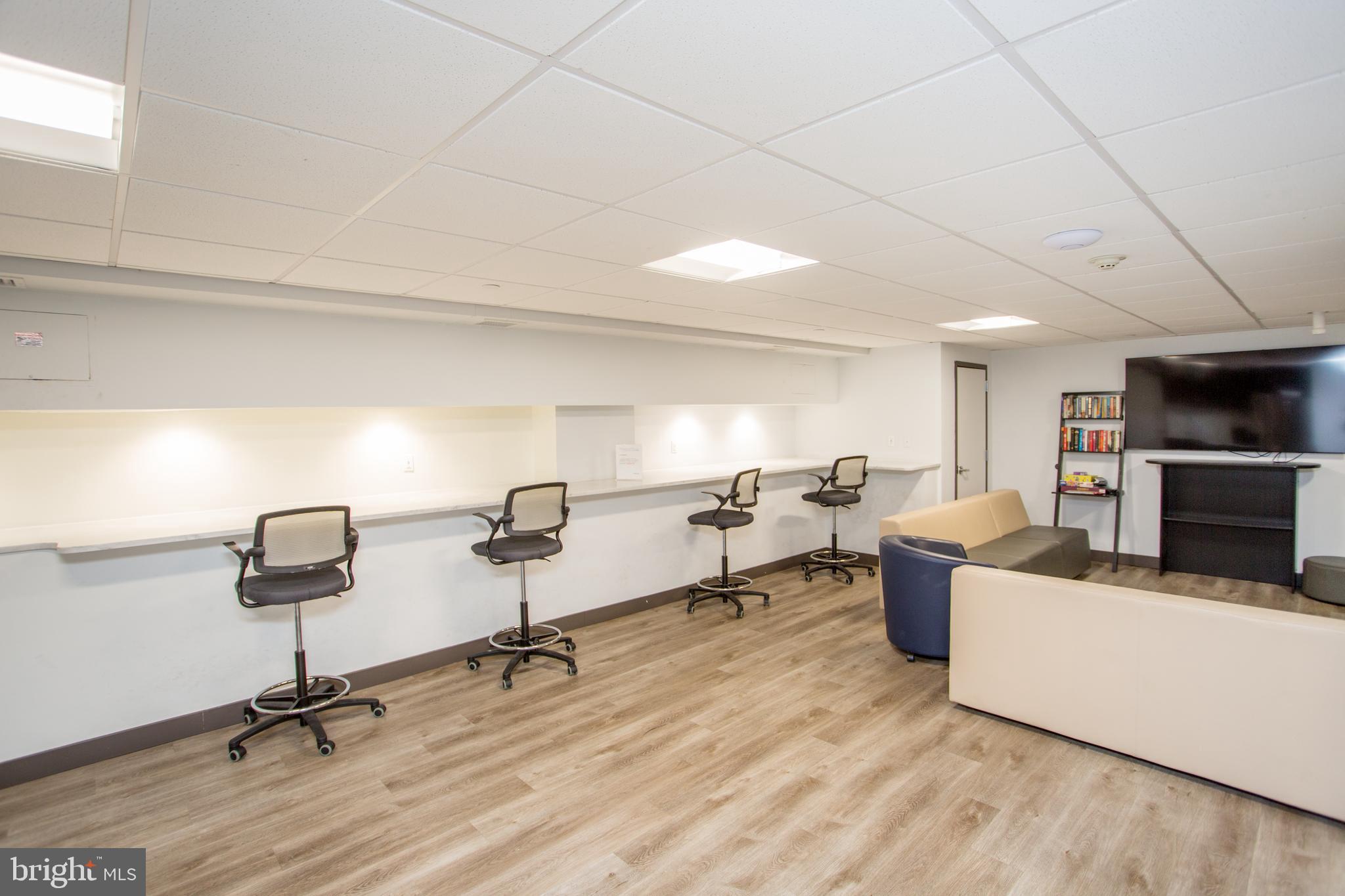 2101-17 Chestnut Street, Unit 1809 Philadelphia, PA 19103 - Photo 34 of 38 a view of a livingroom with furniture and a couch