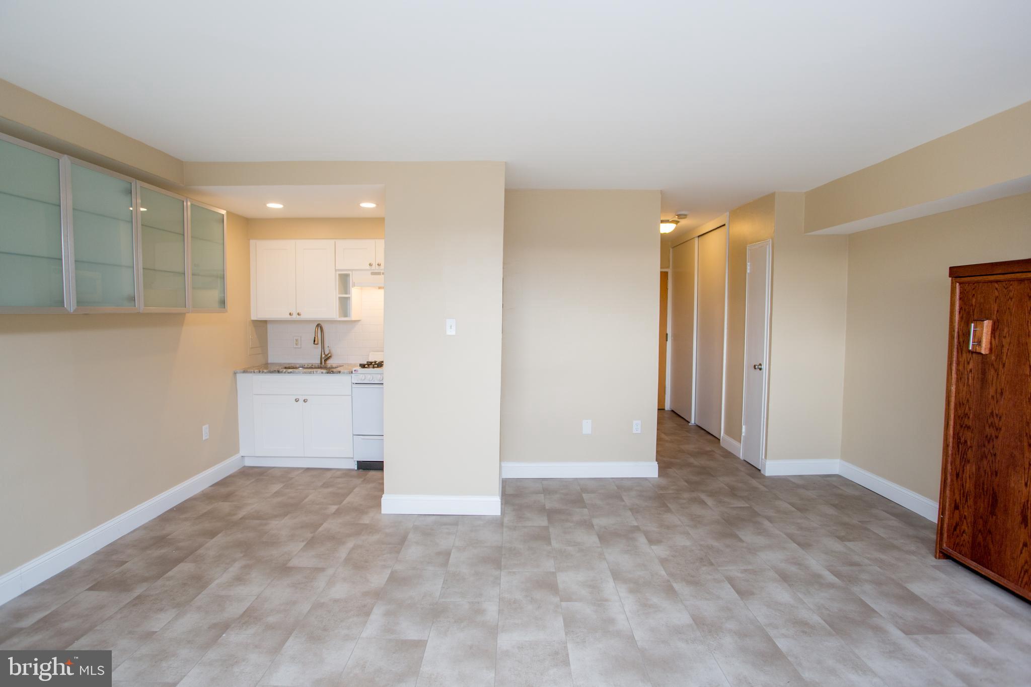 2101-17 Chestnut Street, Unit 1809 Philadelphia, PA 19103 - Photo 9 of 38 a view of a kitchen with a sink
