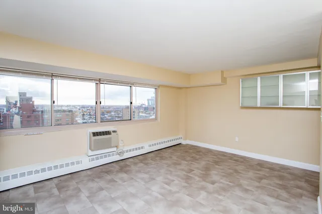 a view of an empty room with a window