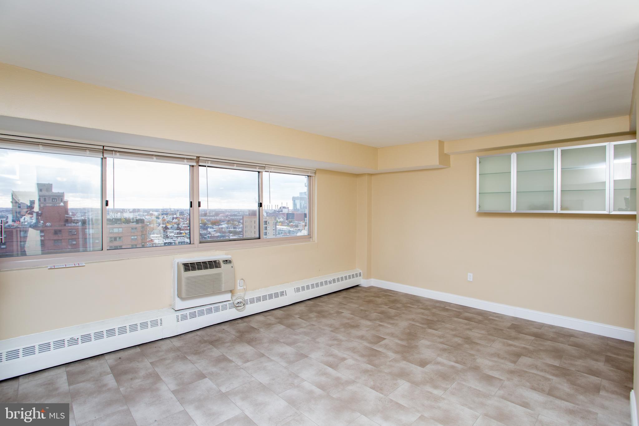 2101-17 Chestnut Street, Unit 1809 Philadelphia, PA 19103 - Photo 10 of 38 a view of an empty room with a window