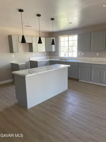a view of hallway with wooden floor