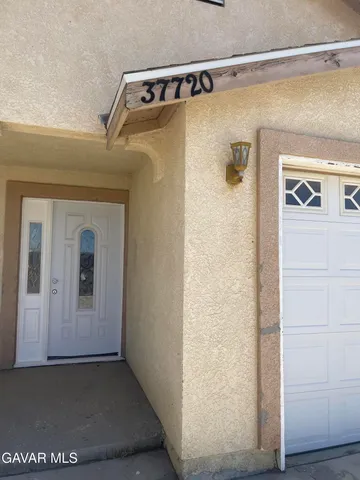 a front view of a house with a outdoor space